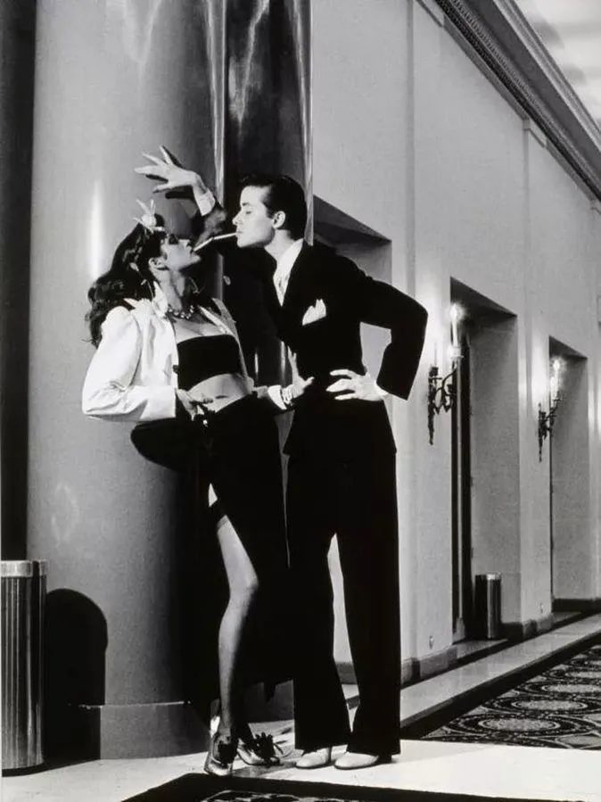 Young woman with shopping bags in a beautiful dress